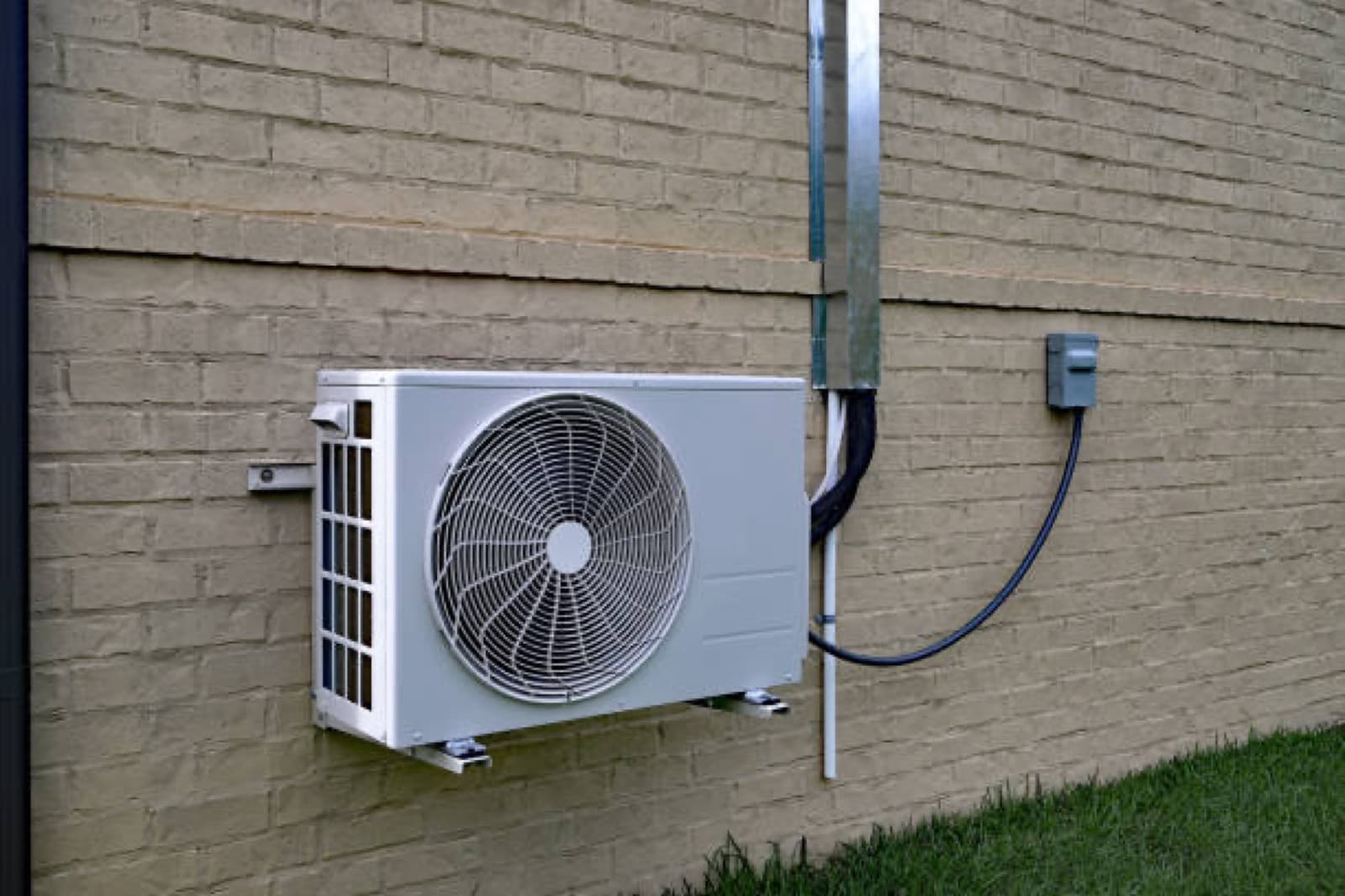 Ductless mini split system installed on a home exterior