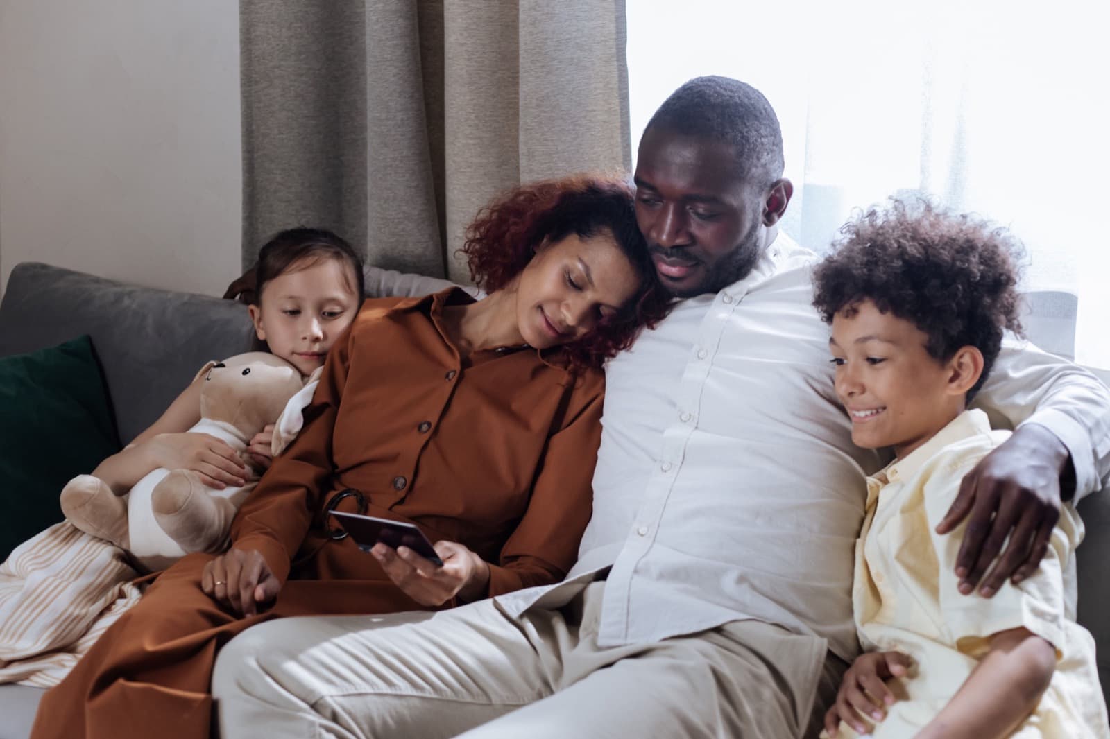 Family relaxing comfortably at home